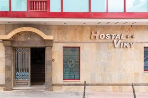 a building with a sign on the side of it at Hostal Viky in Madrid