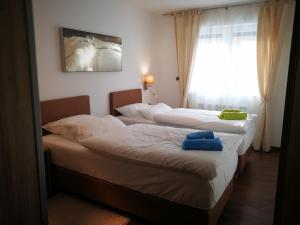 Postel nebo postele na pokoji v ubytování Appartements Onyx