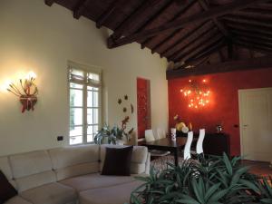 a living room with a couch and a table at Feeling at Home - Varese Apartment in Varese