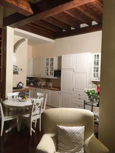 a kitchen and dining room with a table and chairs at Montecchio in Padova