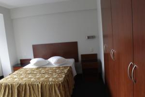 Postel nebo postele na pokoji v ubytování Hostal Bond
