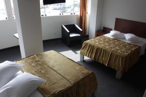 Postel nebo postele na pokoji v ubytování Hostal Bond