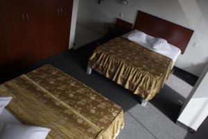 Postel nebo postele na pokoji v ubytování Hostal Bond
