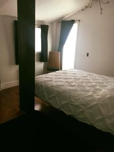 Postel nebo postele na pokoji v ubytování Suites North Hatley
