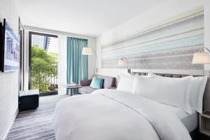 Een bed of bedden in een kamer bij Park Terrace Hotel