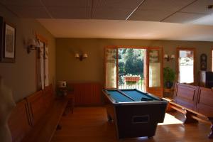 a living room with a pool table in it at Hotel Sabocos in Panticosa