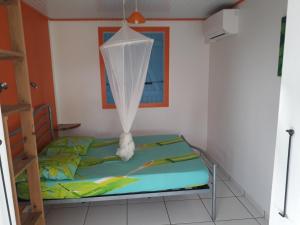 Letto o letti in una camera di ti case gwada location