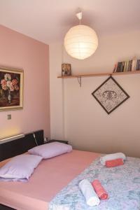 A bed or beds in a room at Serenity Villa-1st floor-Sea view- sea 150m away