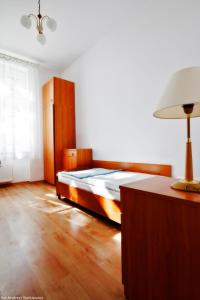 Postel nebo postele na pokoji v ubytování DS Cztery Pory Roku