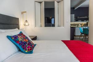 Un pat sau paturi într-o cameră la MyPlace Zocalo