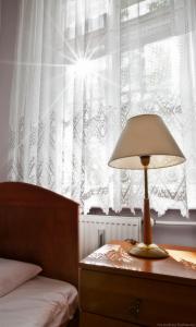 Postel nebo postele na pokoji v ubytování DS Cztery Pory Roku