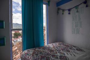 Postel nebo postele na pokoji v ubytování Hostal La Isla