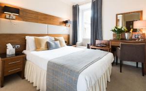 מיטה או מיטות בחדר ב-Rosehill Guest House