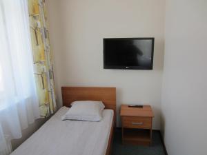 Postel nebo postele na pokoji v ubytování Livonija