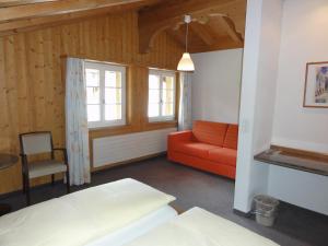 Hotel Steinbock Grindelwald客房内的一张或多张床位