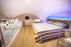 Postel nebo postele na pokoji v ubytování OroVerde Rooms & Suite nel cuore di Trani