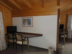 TV a/nebo společenská místnost v ubytování Hotel Steinbock Grindelwald