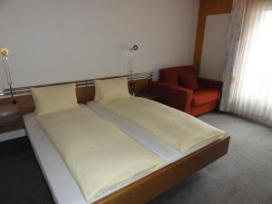 Hotel Steinbock Grindelwald客房内的一张或多张床位