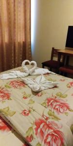 Postel nebo postele na pokoji v ubytování Hotel Mandarin