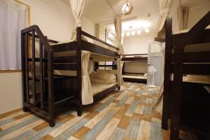 Postel nebo postele na pokoji v ubytování Cinnamon Guesthouse Dogo