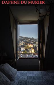 Ένα ή περισσότερα κρεβάτια σε δωμάτιο στο Hotel Brighton