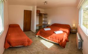 Una cama o camas en una habitación de Las Agachonas Apart