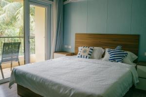 Voodi või voodid majutusasutuse Saipan Emerald Villa toas