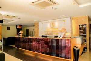 a store with a counter in a room at Shervinton Executive Boutique Hotel in Tawau