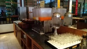 a kitchen with a bunch of glasses on a counter at Supalai Scenic Bay Resort And Spa, SHA Extra Plus in Por Bay