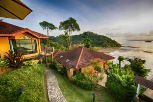 an aerial view of a house next to the water at Supalai Scenic Bay Resort And Spa, SHA Extra Plus in Por Bay