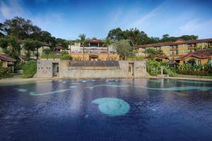 a pool of water in front of a building at Supalai Scenic Bay Resort And Spa, SHA Extra Plus in Por Bay