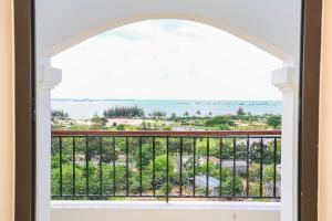 a window view of the ocean from a condo at Hacom Galaxy Hotel in Phan Rang–Tháp Chàm