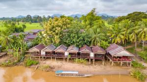 an aerial view of a resort on the river at Mr Tho's Bungalows in Don Det