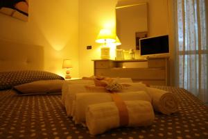 Postel nebo postele na pokoji v ubytování B&B Le Colombine