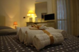 Postel nebo postele na pokoji v ubytování B&B Le Colombine