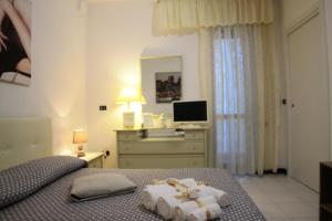 Postel nebo postele na pokoji v ubytování B&B Le Colombine