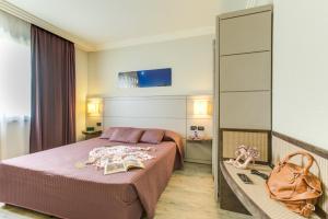 Postel nebo postele na pokoji v ubytování Ardeatina Park Hotel