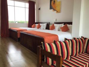 Postel nebo postele na pokoji v ubytování Avonil Resort Yala