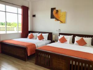 Postel nebo postele na pokoji v ubytování Avonil Resort Yala