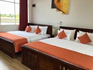 Postel nebo postele na pokoji v ubytování Avonil Resort Yala