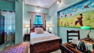 Postel nebo postele na pokoji v ubytování Ikaki Niwas - A Heritage Boutique Hotel