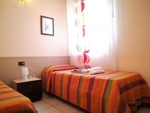 A bed or beds in a room at Villa Verdemare San Lorenzo