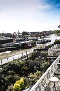 a view of a river with boats in the water at CreekSide Bed and Breakfast Faversham in Faversham