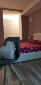 A bed or beds in a room at Cuorematto