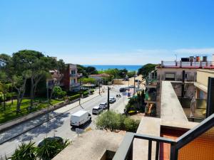a view of a city street with cars on the road at Beach House Castelldefels in Castelldefels