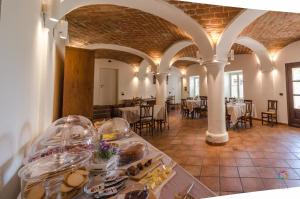a room with a table with food on it at Agriturismo Podere La Piazza in Costigliole dʼAsti