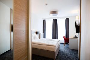 Postel nebo postele na pokoji v ubytování Hotel Koflík