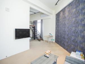 TV a/nebo společenská místnost v ubytování Rainbow Hotel
