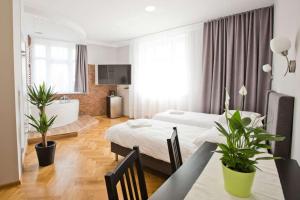 Posteľ alebo postele v izbe v ubytovaní R&B APARTMENTS POZNAŃ
