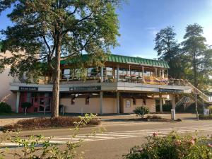 a building with a balcony on the side of a street at Hotel „Zur Linde“ in Ehingen